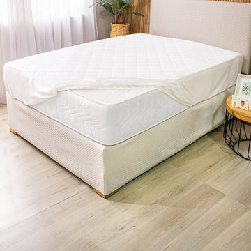Protector de colchón hotelero diseñado para uso intensivo y lavado industrial
